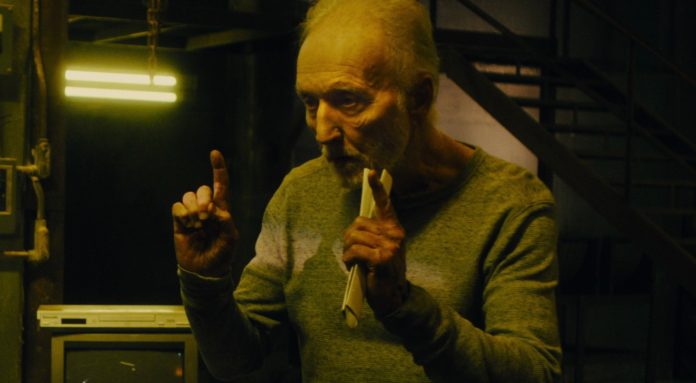 Tobin Bell in Saw XI Setting